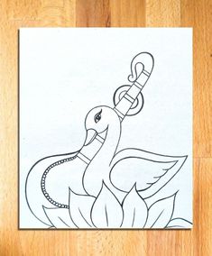 a drawing of a bird with a chain around its neck on a piece of paper