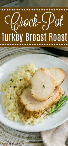 crock - pot turkey breast roast on a plate with rice and garnish