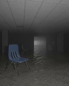 an empty room with two chairs in the middle and water on the floor around it