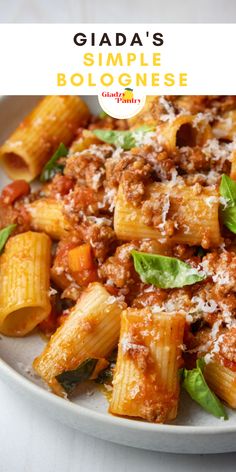 a white plate topped with pasta and sauce