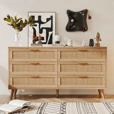 a large wooden dresser sitting in a living room next to a painting on the wall