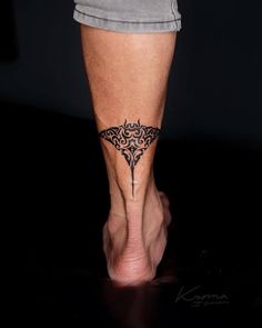 a woman's foot with a tattoo on it