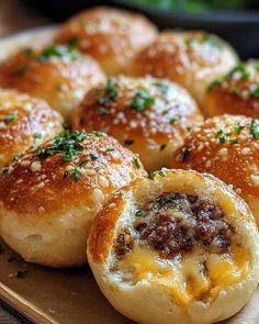 some bread rolls with cheese and meat in them