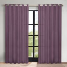 a purple curtain hanging in front of a window