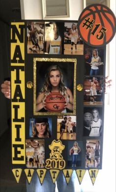 a woman holding a basketball in front of her face and photos on the wall behind her