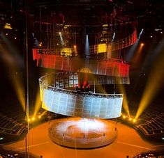 an aerial view of a large stage with lights on it and people in the audience