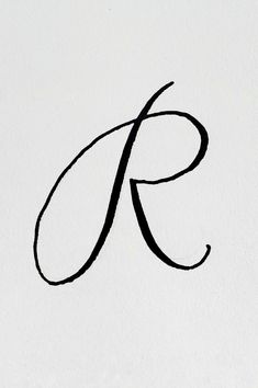 the letter k is written in cursive writing on a white paper with black ink