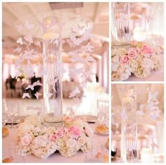 the table is set with flowers and butterflies in vases, candles, and centerpieces