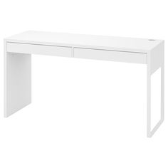 a white desk sitting on top of a white floor