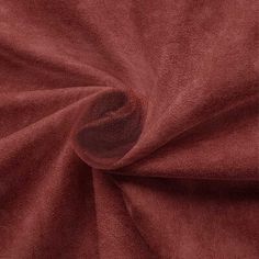 a close up shot of a red velvet fabric