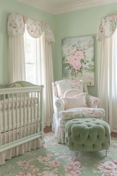 a baby's room with green walls and pink flowers