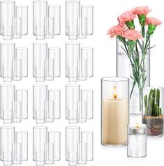 there are many vases with flowers in them and one has a candle on it