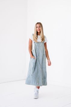 Refresh your look with the ultra-trendy Kristin Denim Overall Dress. Featuring an oversized, baggy silhouette with frayed edges, this timeless denim piece exudes effortless style and comfort. Crafted for all of your laid-back, yet stylish occasions. Model Measurements: Hips 34” Waist 25” Bust 32” Height 5’6.5, wearing a size small 100 Cotton Overalls, Denim Overall Dress, Overall Dress, Dress First, Dusty Blue, Model Measurements, Denim Women, Effortless Style, Size Small