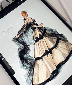 a drawing of a woman in a black and white dress on top of a table