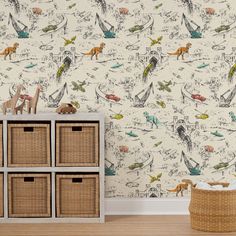 an animal themed wallpaper in a child's room with toy animals and baskets