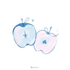 two apples with blue and white designs on them