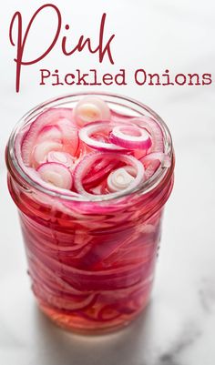 a jar of pickled onions. Slicing Onions, Red Onion Recipes, Quick Pickled Red Onions, Quick Pickled Onions, Quick Pickled, Pink Food, Barbecue Pork, Pickled Veggies, Homemade Pesto