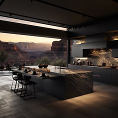 a large kitchen with an island in front of a window overlooking the mountains and desert