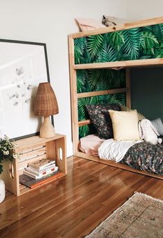 a bunk bed sitting on top of a wooden floor