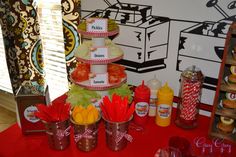 a table topped with lots of different types of food and condiments on top of it