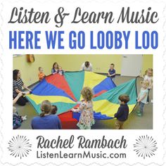 children are playing with a large kite in the middle of a school room, and an advertisement for listen & learn music here we go lobby loo