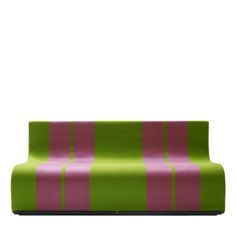 a green and pink striped couch sitting on top of a white floor