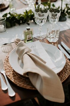 a place setting with napkins and silverware