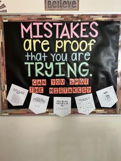 a bulletin board with notes attached to it