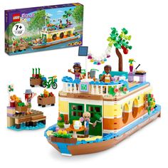 a lego boat with people on it in front of a box