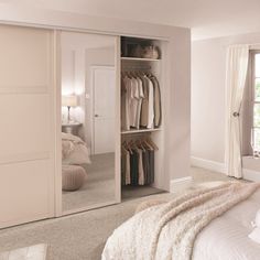 a bedroom with a bed and closet in it