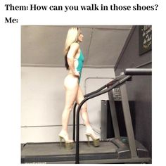 a woman is walking on a treadmill and has her leg up in the air