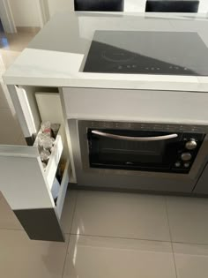 an oven built into the side of a counter