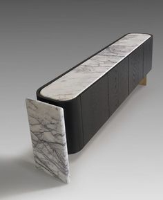 a black and white bench with marble top