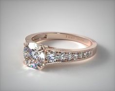 a white gold engagement ring with diamonds on it