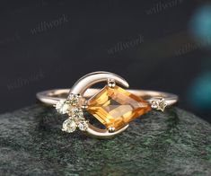 Symbolizing the magic of love under moonlit skies, this enchanting ring features a gleaming citrine gemstone reminiscent of a radiant moon, adorned with delicate star that illuminate the path of your shared journey. The main stone is a 6x9mm kite cut natural citrine. The accent stones are round cut natural peridot. Thi Big Gem Ring, Alt Rings, Yellow Wedding Ring, Moon Wedding Ring, Citrine Promise Ring, Citrine Wedding Ring, Citrine Rings, Citrine Engagement Ring, Wedding Orange