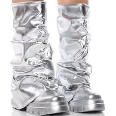 The Azalea Wang " Combat Beauty " Metallic Mid Calf Boot In Silver Is Made From A Metallic Faux Leather Upper And Features A Scrunched Foldover Mid Calf-Height Shaft, And A Chunky Covered Flatform Sole. Complete With A Rounded Toe And Pull-On Fit. - Pu Upper - Mid Calf-Height Shaft - Rounded Toe - Flatform Sole - 12” Shaft Height - 17" Calf Circumference - 2.5” Heel Height - Imported Metallic Futuristic Fashion, Silver Gogo Boots, Metallic Silver Outfit, Metallic Boots Outfit, Chrome Boots, Armor Boots, Album Concept, Silver Outfits, Gray Boots