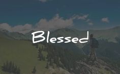 a man standing on top of a mountain with the words blessing written in white above him