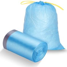 two rolls of blue trash bags sitting next to each other