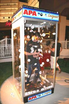 a man standing in front of a machine with buttons on it