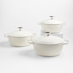 three white casserole dishes with lids