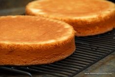 two round cakes sitting on top of a grill