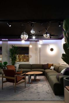 a living room filled with furniture and lights