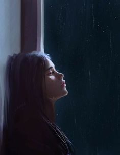 a woman looking out the window in the rain