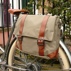 a bicycle with a bag strapped to the back