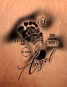 a close up of a person's foot with the words angel on it and an arrow