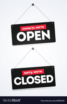 two black and red open signs hanging from strings