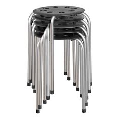 four metal stools stacked on top of each other