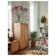 a living room filled with lots of furniture and flowers in vases on top of them