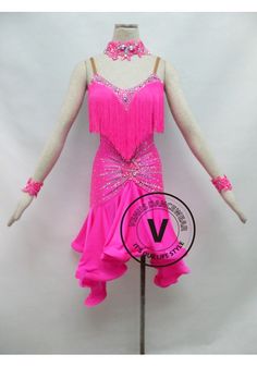 a woman's pink ballroom dress with sequins and beads