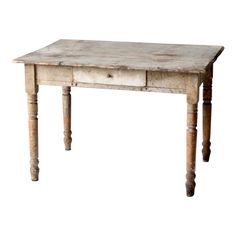 an old wooden table with two drawers on one side and three legs at the top